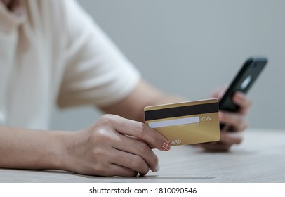 Online payment and shopping, Woman's hands holding credit card and using smartphone mobile for online shopping.