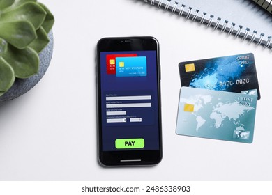 Online payment system. Smartphone with open application on table, top view - Powered by Shutterstock