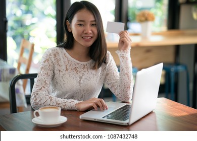 Online payment, women hands holding smartphone and using credit card for online shopping. - Shutterstock ID 1087432748