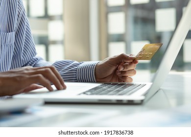 Online payment,businessman hands holding credit card and using  laptop for online shopping. Cyber Monday Concept	