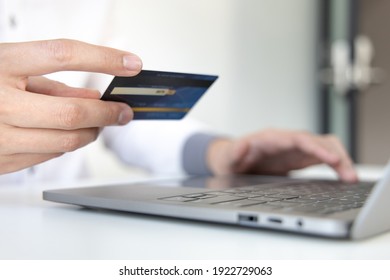 Online Product Purchase, Businessman Use Laptop Register Via Credit Cards To Make Online Purchases, Shopping And Mail, Credit Card Online Security, Online Shopping Concept.