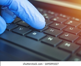 Online Quarantine Training. Remote Online Work. Coronovirus. Epidemic. Hands In Protective Medical Gloves Are Typing On The Keyboard.