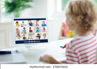 Online remote learning. School kids with computer having video conference chat with teacher and class group. Child studying from home. Homeschooling during quarantine and coronavirus outbreak.