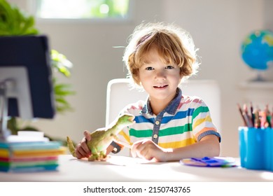 Online Remote Learning. School Kids With Computer Having Video Conference Chat With Teacher And Class Group. Child Coloring Clay Dinosaur. Arts And Crafts For Kid From Home From Home. Homeschooling.