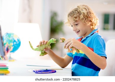 Online Remote Learning. School Kids With Computer Having Video Conference Chat With Teacher And Class Group. Child Coloring Clay Dinosaur. Arts And Crafts For Kid From Home From Home. Homeschooling.