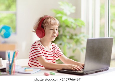 Online remote learning. School kids with computer having video conference chat with teacher and class group. Child studying from home. Homeschooling during quarantine and coronavirus outbreak. - Powered by Shutterstock