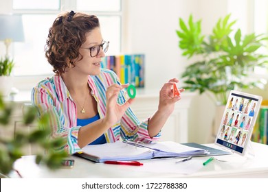 Online remote learning. Teacher with computer having video conference chat with student and class group. Teaching and learning from home. Homeschooling during quarantine and coronavirus outbreak. - Shutterstock ID 1722788380
