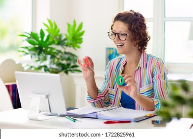 Online remote learning. Teacher with computer having video conference chat with student and class group. Teaching and learning from home. Homeschooling during quarantine and coronavirus outbreak. - Shutterstock ID 1722825961