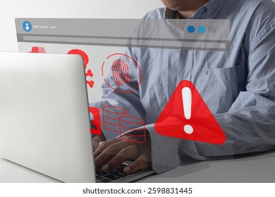 Online security,Data protection,Cybersecurity threats,Digital security concept.,A man typing on a laptop with a cybersecurity warning, fingerprint, skull icon, and data symbols. - Powered by Shutterstock - Get 15% off with code: PIKWIZARD15