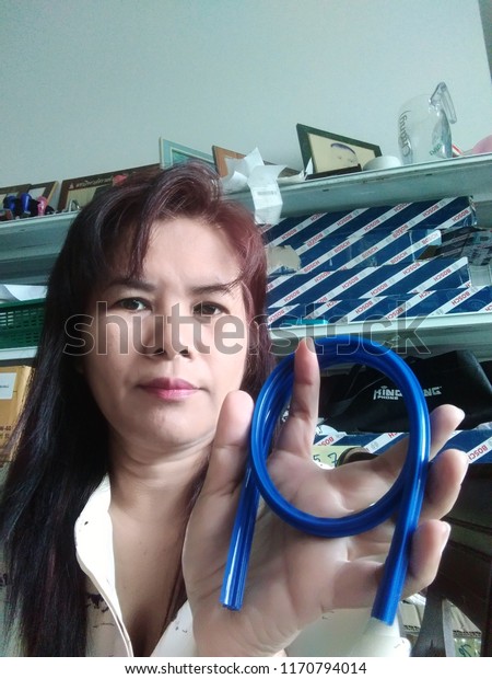 Online seller hold\
wiper blade refill with a stock of products background: Khon Kaen,\
Thailand, August 30,\
2018.