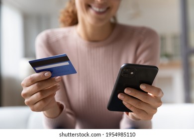 Online Shopper. Close Up Of Happy Millennial Female Satisfied Bank Web Shop Customer Buying Paying Easy From Home. Focus On Woman Hands Typing Data From Credit Card In Banking App On Cellphone Screen