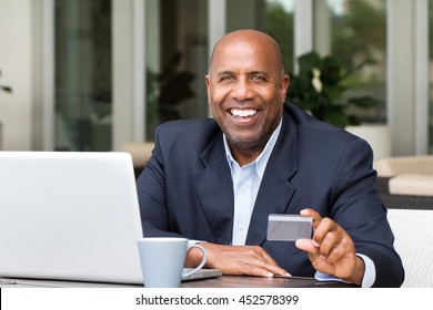 Online Shopping. African American Man Holding A Credit Card. 