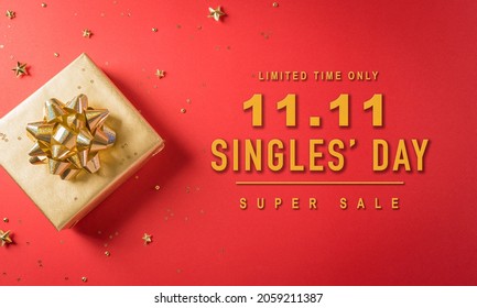 Online Shopping Of China, 11.11 Singles Day Sale Concept. Top View Of Golden Christmas Gift Boxes With Ribbon On Red Background