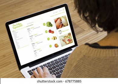 online shopping concept: online supermarket on a laptop screen. Screen graphics are made up.