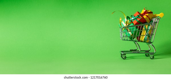 Online Shopping Concept - Trolley Cart Full Of Presents. Black Friday And Ciber Mondey