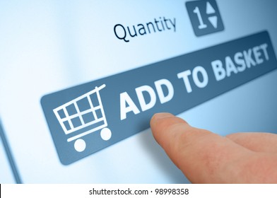 Online Shopping - Finger Pushing Add To Basket Button On Touchscreen