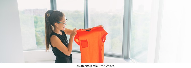 Online Shopping Panoramic Crop. Buying New Clothes Concept. Asian Woman Happy Looking At Orange Silk Top From Clothing Store Banner.