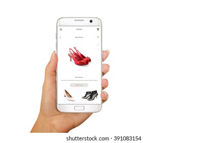 Online Shopping With Smart Phone. Isolated Phone In Woman Hand. Buying Women Shoes
On Online Store.