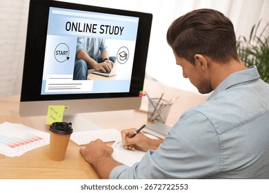 Online study. Man using computer for e-learning at desk