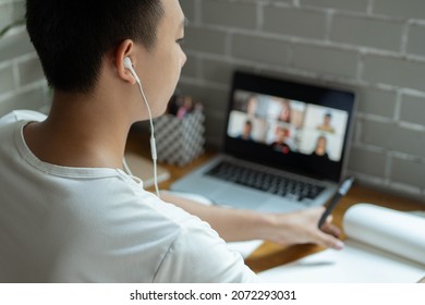 Online studying concept the university student trying to explain his opinion towards the subject that he concludes on the notebook while his classmates are listening to it. - Shutterstock ID 2072293031