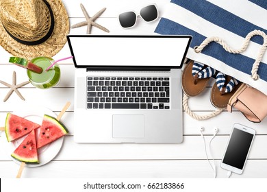 Online Summer Preparations Concept With Modern Laptop, Beach Bag And Accessories