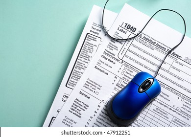 Online Tax Form Concept With Blue Mouse Over 1040 Tax Form