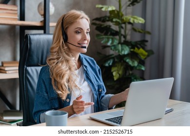 Online tutoring, distance education e-learning, videocall videoconference meeting on web. Businesswoman on webinar, listening remote course on laptop in home office. Social isolation - Powered by Shutterstock