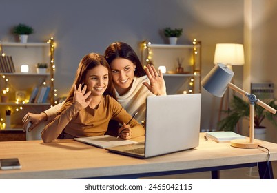 Online video call and chat interaction, mother and daughter communicating via laptop. Happy family making visual call, greeting, talking, videoconferencing with parent, friends, distant family member - Powered by Shutterstock