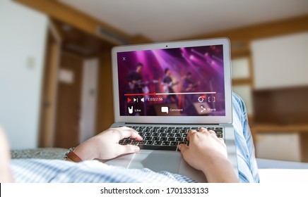 Online Video Streaming Concept.Female Watching Music Video Via Laptop At Home