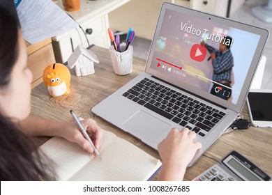 Online Video Tutorial Concept.Female Using Laptop Or Pc On Wooden Table