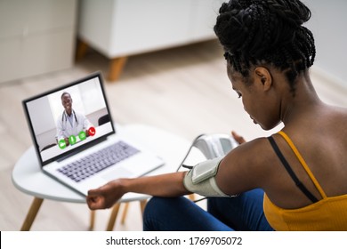 Online Videoconference On Laptop With African Doctor