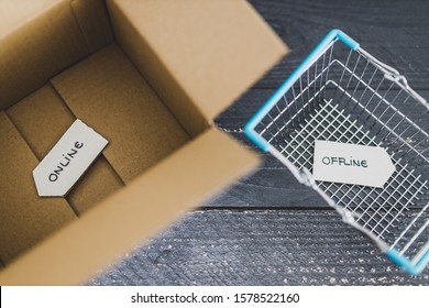 Online Vs Retail Shopping Conceptual Still-life, Parcel And Shopping Basket With Online And Offline Signs