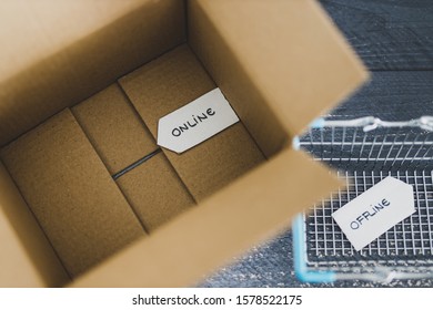 Online Vs Retail Shopping Conceptual Still-life, Parcel And Shopping Basket With Online And Offline Signs