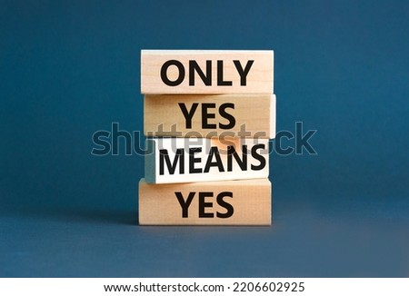 Only yes means yep symbol. Concept words Only yes means yes on wooden blocks on a beautiful grey table grey background. Business, psychological only yes means yep concept.