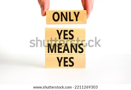 Only yes means yep symbol. Concept words Only yes means yes on wooden blocks on a beautiful white table white background. Businessman hand. Business, psychological only yes means yep concept.