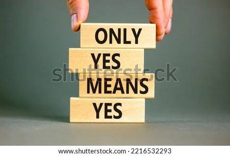 Only yes means yep symbol. Concept words Only yes means yes on wooden blocks on a beautiful grey table grey background. Businessman hand. Business, psychological only yes means yep concept.