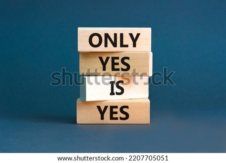 Only yes is yep symbol. Concept words Only yes is yes on wooden blocks on a beautiful grey table grey background. Business, psychological only yes is yep concept.