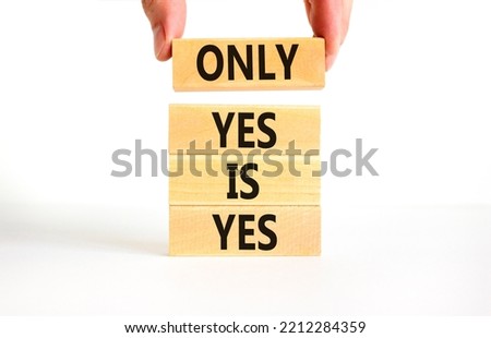 Only yes is yep symbol. Concept words Only yes is yes on wooden blocks on a beautiful white table white background. Businessman hand. Business, psychological only yes is yep concept.