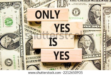 Only yes is yep symbol. Concept words Only yes is yes on wooden blocks on a beautiful background from dollar bills. Business, psychological only yes is yep concept.