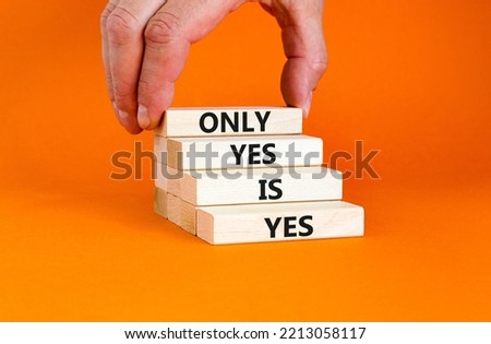 Only yes is yep symbol. Concept words Only yes is yes on wooden blocks on a beautiful orange table orange background. Businessman hand. Business, psychological only yes is yep concept.