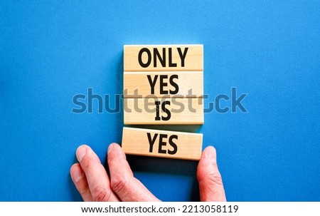Only yes is yep symbol. Concept words Only yes is yes on wooden blocks on a beautiful blue table blue background. Businessman hand. Business, psychological only yes is yep concept.