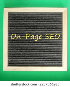 On-Page SEO, On-Page Search Engine Optimization ranking concept, word on the board , isolated on green background, the idea of promote traffic to website.