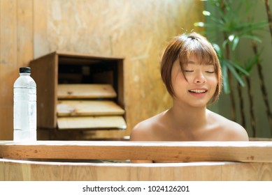 Onsen Series: Asian Woman Taking A Bath In Wooden Bathtub