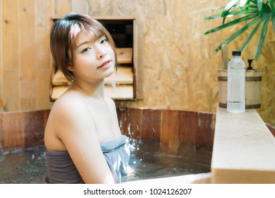 Onsen Series: Asian Woman Taking A Bath In Wooden Bathtub