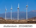 Onshore wind turbines at wind farm on sunny summer day, sustainable renewable electricity concept, Tenerife, Spain