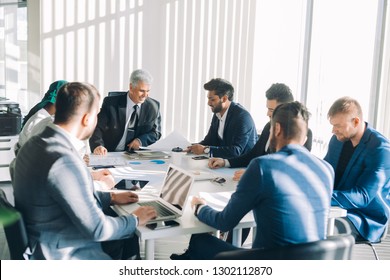  Onstruction Company Management Board Members Headed By Grey-haired Caucasian Director Analyzing Company Statistics During Office Meeting, Consider Stats Diagrams Making Predictions