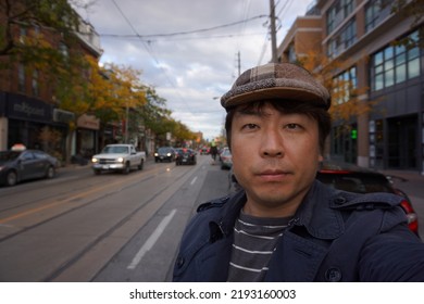 Ontario, Canada, 10 25 2017 : A Man Standing At Queen Street West In Toronto City