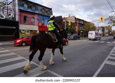 Ontario, Canada, 10 25 2017 : A Mounted Police Officer At Queen Street West In Toronto City