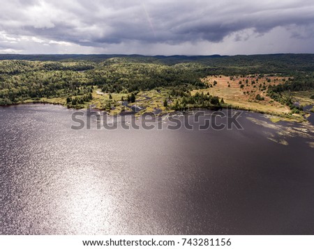 Ontario Canada contryside nature Aerial view looking down from above of river flowing inside lake