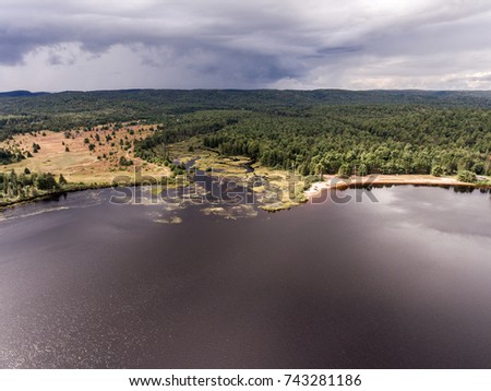 Ontario Canada contryside nature Aerial view looking down from above of river flowing inside lake